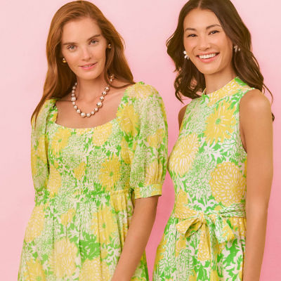 Women wearing a yellow printed dresses