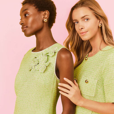 Women wearing green boucle outfits