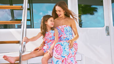 Woman and little girl wearing red white and blue printed dresses