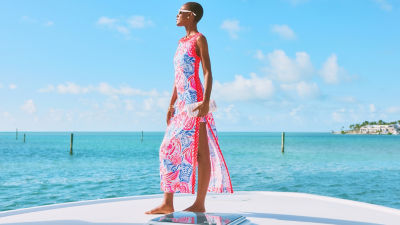 Woman wearing a blue red and white printed maxi dress