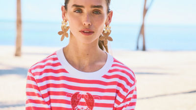 Woman wearing a red and white striped sweatshirt