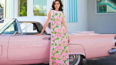Woman wearing a pink printed maxi romper