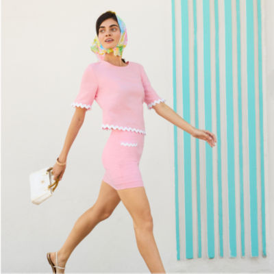 Woman wearing a pink top and skort