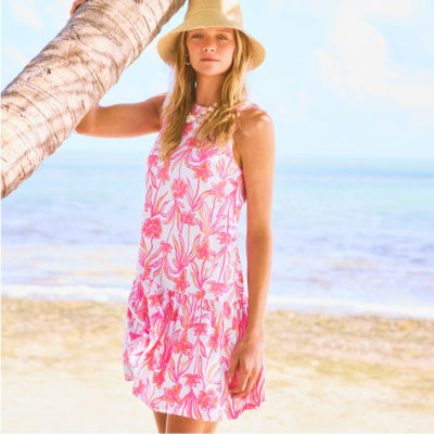Woman wearing a white and pink printed dress