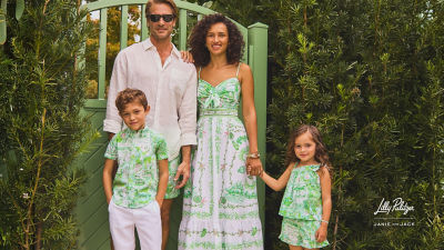 Family in coordinating green and white outfits