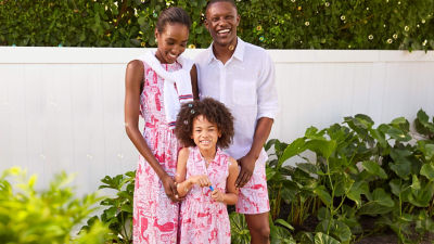 Family wearing red and white outfits