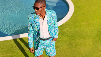 Man wearing a blue printed jacket and shorts