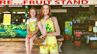 Girls wearing yellow printed outfits