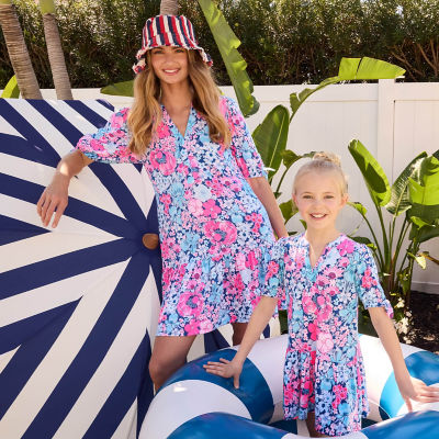 Woman and little girl wearing matching blue printed dresses