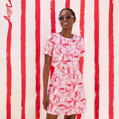 Woman wearing a red and white printed dress