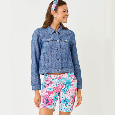 Woman wearing a blue jacket and blue printed shorts