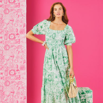 Woman wearing a long green printed dress