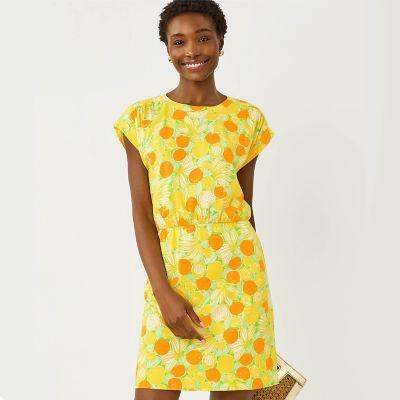 Woman wearing a yellow printed dress