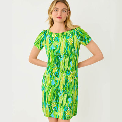 Woman wearing a green printed dress