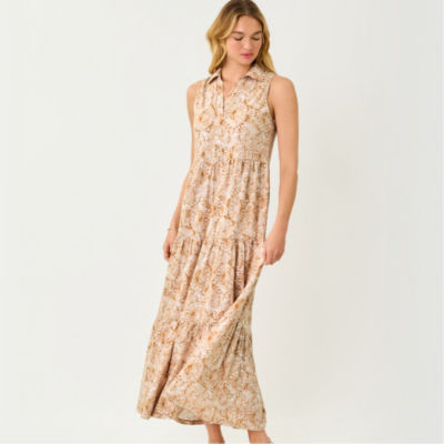 Women wearing a long tan printed dress